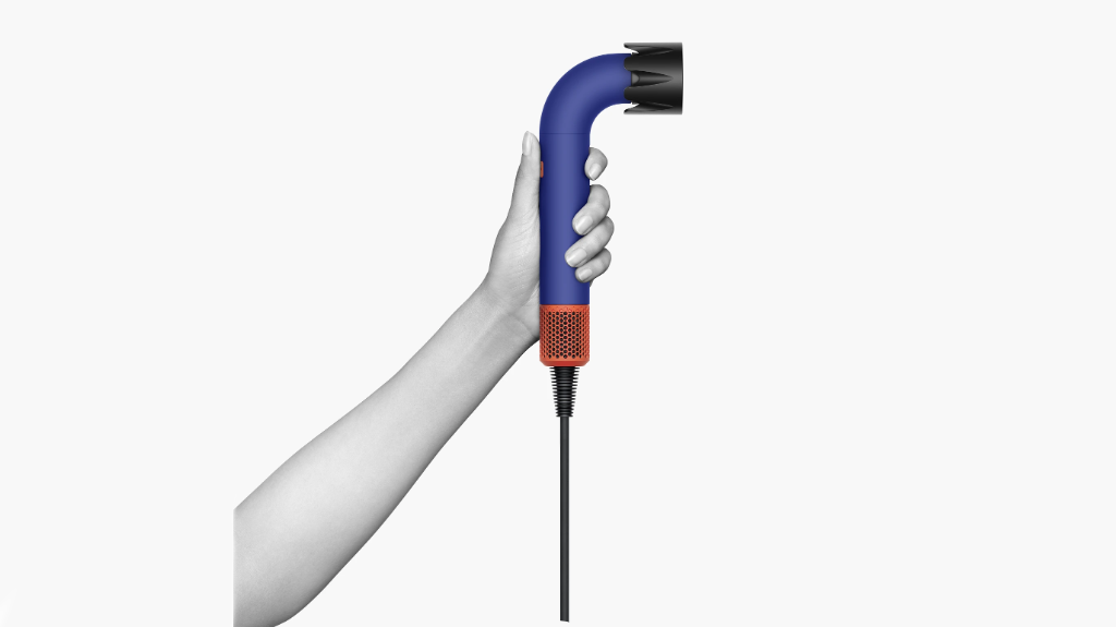 hand holding dyson supersonic r