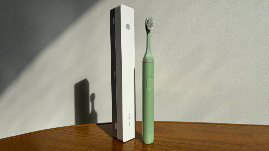 an image of the suri electric toothbrush on a wooden table