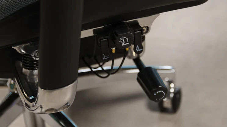 A close up of the Sihoo Doro S300 office chair's adjustment levers and tilt tension knob