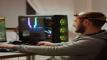 The best broadband for gamers man using a gaming computer