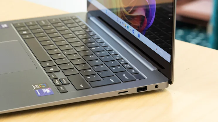 The Samsung Galaxy Book5 Pro pictured from the right, open with a close up on the right side ports