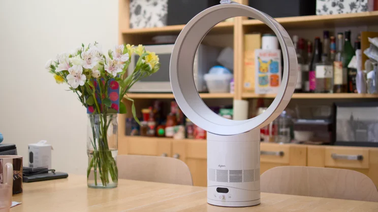 Dyson Cool CF1 on a kitchen table with flowers and shelving in the background