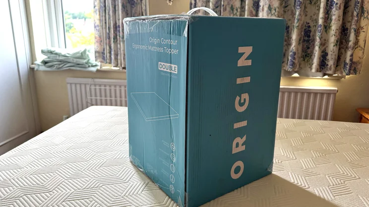 The Origin Contour Mattress Topper in its box