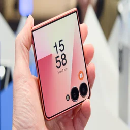 Samsung Galaxy Z Flip 7 folded in hand, cover display on