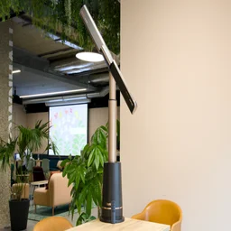 The Shark TurboBlade fan positioned on a table in an office